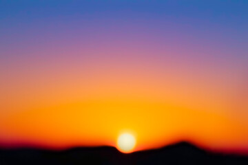 Sunrise sunset sky purple blue yellow orange golden gradient clouds mountain. Summer spring seasonal weather climate dramatic background. Beautiful morning colourful cloudscape.