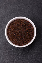 Black tea dry crushed in bowl
