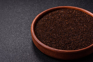 Black tea dry crushed in bowl