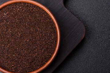 Black tea dry crushed in bowl