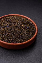 Dry green tea with soursop piece, knapweed petals in bowl