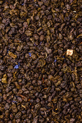 Dry green tea with soursop piece, knapweed petals in bowl