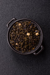 Dry green tea with soursop piece, knapweed petals in bowl
