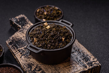 Dry green tea with soursop piece, knapweed petals in bowl