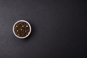 Dry green tea with soursop piece, knapweed petals in bowl
