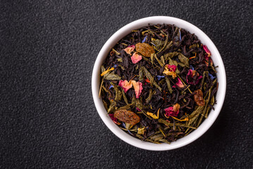 Dry tea mix blend black, green and flower petals in bowl