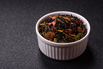 Dry tea mix blend black, green and flower petals in bowl