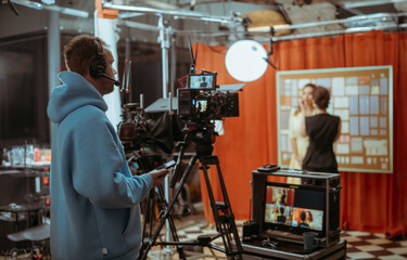 Film set, monitors and modern shooting equipment. Film crew, lighting devices, monitors, playbacks - filming equipment and a team of specialists in filming movies, advertising and TV series