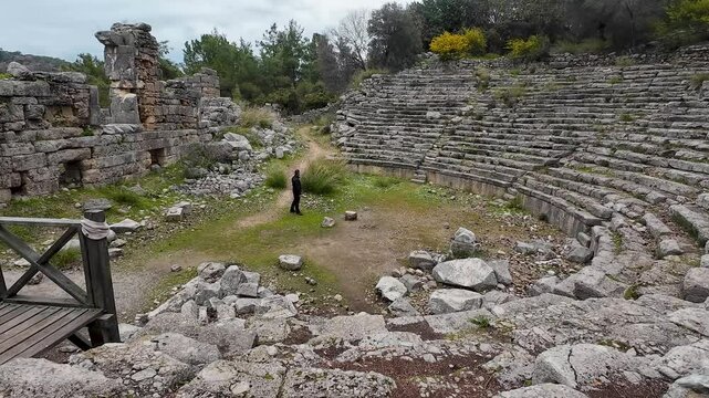 Antalya Phaselis Ancient City. Travel footage among the ruins. A man watching the sea and the view from the beach.