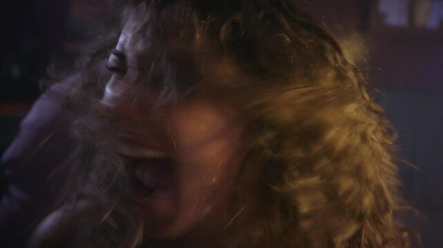 psychotic young woman  (possibly possessed) raging and screaming