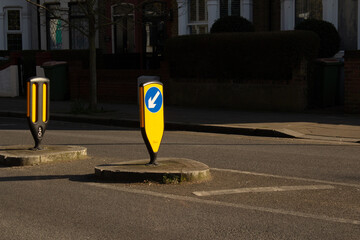 A traffic sign in the middle of the road.