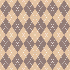 Fototapeta premium Seamless argyle pattern with beige and brown rhombuses and white stitches, creating a classic and sophisticated background