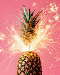 Pineapple with party cake sparkles. Minimal food concept.