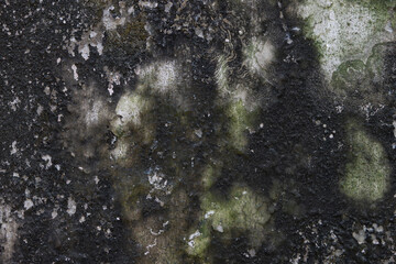 Grungy weathered concrete wall with cracks and stains, exuding a raw, aged texture background