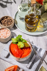 Pickled tomatoes with herbs and spices served in bowl
