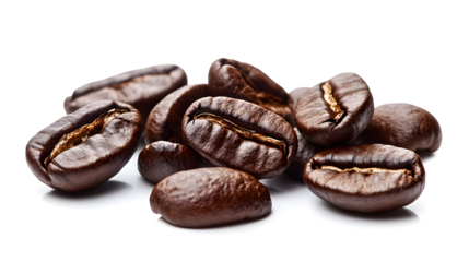A pile of coffee beans with a brown color. The beans are spread out on a white background