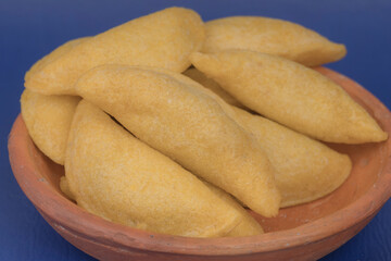 Colombian empanada with spicy sauce 