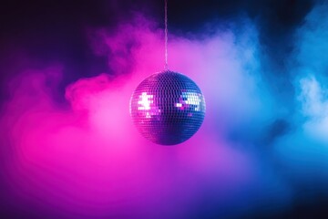 Obraz premium Hanging disco ball in pink and blue mist 