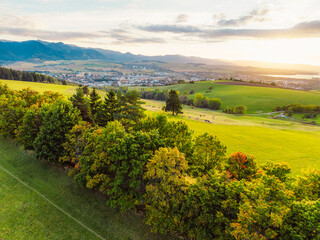 Obraz premium Sunset over Liptov region with Liptovska Mara lake and Tatras mountains around. Liptovsky mikulas landspace, slovakia.