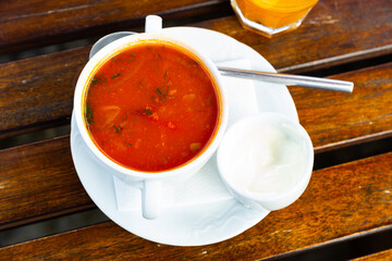 Popular Russian soup Solyanka with assorted meat and sausages