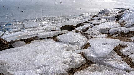 ice on the beach lake Engolastern, Andorra