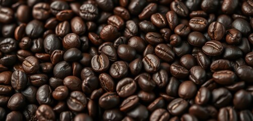 Fototapeta premium Dark roasted coffee beans close-up, rich aroma, espresso, roasted