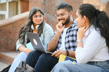 Group of smiling multiethnic near university campus