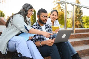 Group of smiling multiethnic near university campus