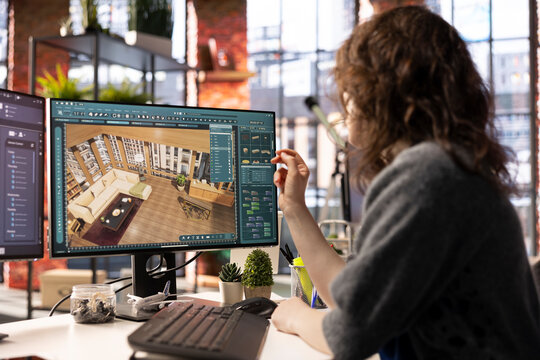Home design professional uses architectural software to develop a floor plan, digital tool offers an intuitive interface for rendering apartment interiors with precise furniture placement.
