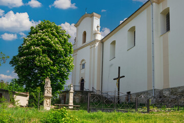 Church of the Exaltation of the Holy Cross rising in Budaniv, Ternopil region, Ukraine, under blue sky