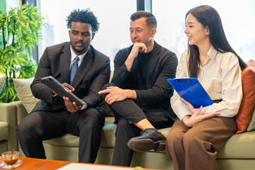 Businesswoman insurance agent presenting health or auto insurance policy details to businessmen,...