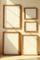 Fototapeta premium Several empty wooden picture frames against a beige wall, bathed in sunlight , photography, design