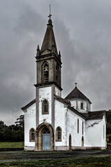 Fototapeta premium Old church with bell tower on a cloudy day