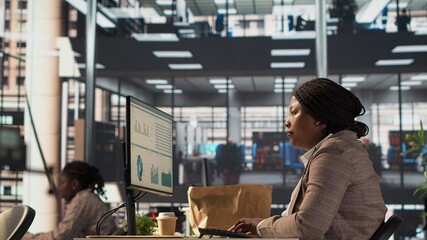 Professional woman at desk in corporate office receiving her delivery lunch order. Takeaway service...