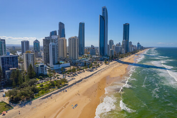 Tourists return to Surfers Paradise after the beach suffered storm damage and sand erosion caused...
