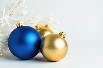 Sophisticated Christmas baubles in blue and gold, white backdrop , background, holiday