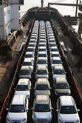 A large cargo ship loaded with cars for international transport, showcasing efficient vehicle shipping logistics.