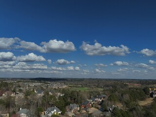 Beautiful aerial view of a sub division with golf course and a beautiful lake in suburbs of Atlanta during golden hour.