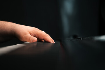Piano player hands playing keyboard musical instrument music production studio