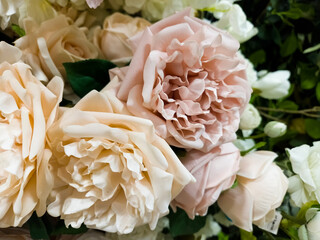 Floral backdrop pattern with vibrant close up flower blooms and foliage