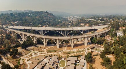 Colorado Street Bridge in Pasadena, California, USA. Cars and trucks drive across the bridge,...