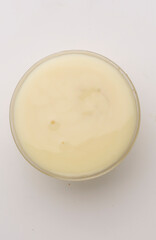bowl of condensed milk on a gray background