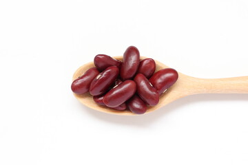 beans in a wooden spoon