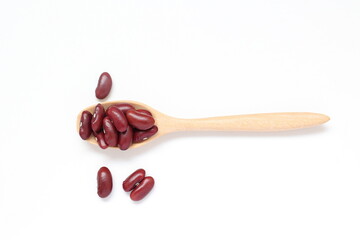 Red kidney beans in spoon on white background 