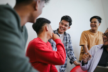 Obraz premium Portrait Of Smiling Multi Generation Group Having Fun And Laughing Together on Therapy Session