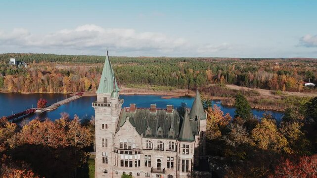 Tracking shot towards Teleborg Castle in V&auml;xjo, Sweden, Fall, Orange and Yellow Leafs