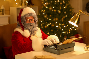 Santa Claus with typewriter writing Christmas story at night