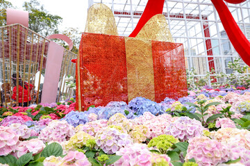 Gift Box Display in a Floral Garden Setting with Hydrangea