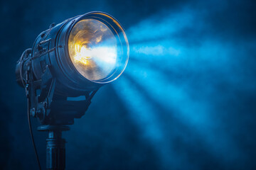 a spotlight shines on the black background,