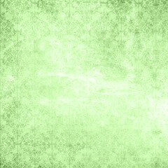 Obraz premium Light green grunge texture background with soft distressed pattern and subtle vintage effect. Fresh, organic backdrop ideal for eco design, nature themes, posters, overlays, and creative projects.